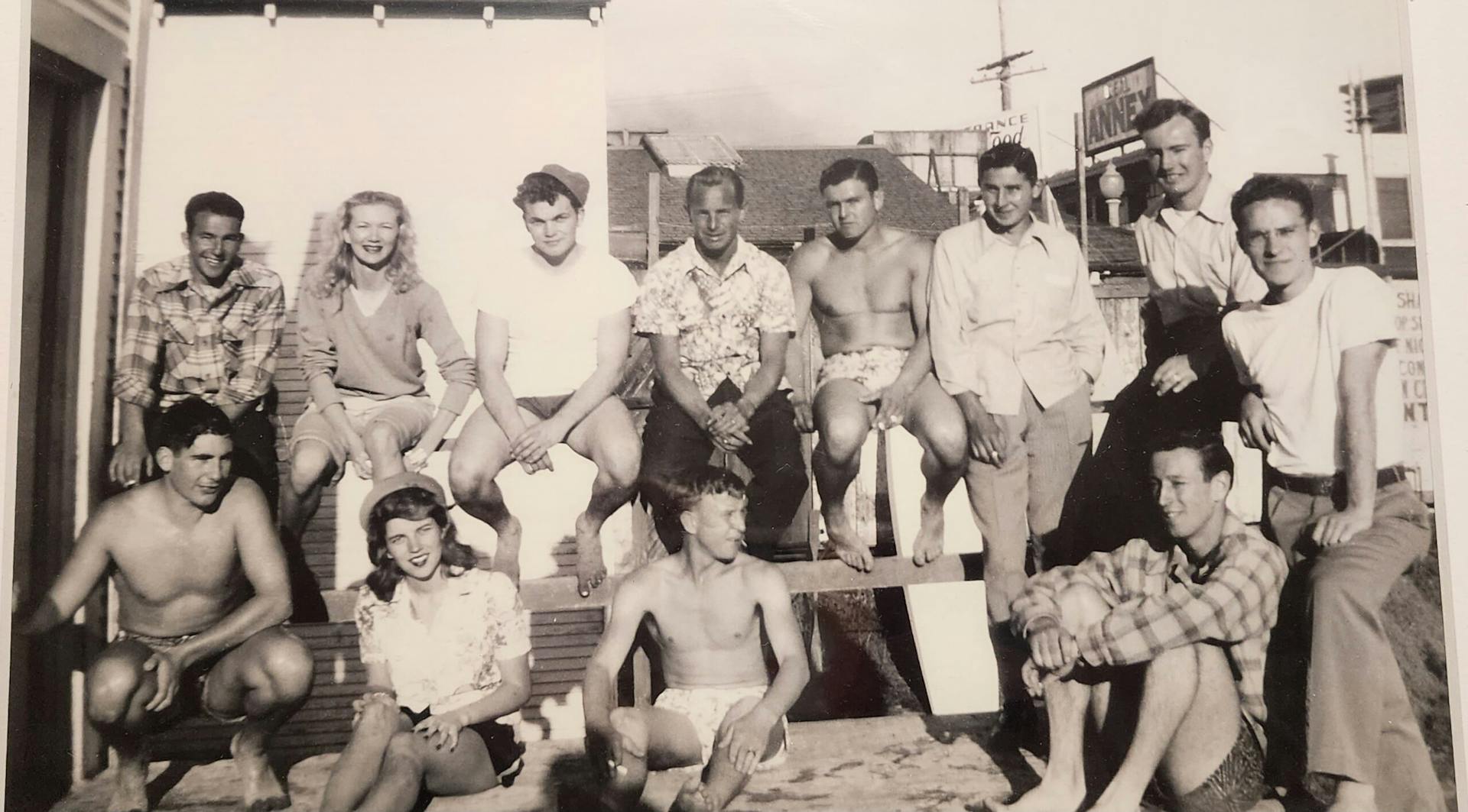 Ritt and his friends hanging out along a beach rail