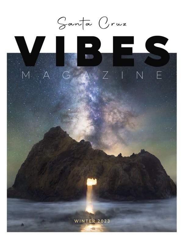 Santa Cruz Vibes Winter 2023 cover with nighttime image of the keyhole-shaped arch at Pfeiffer Beach along California coast
