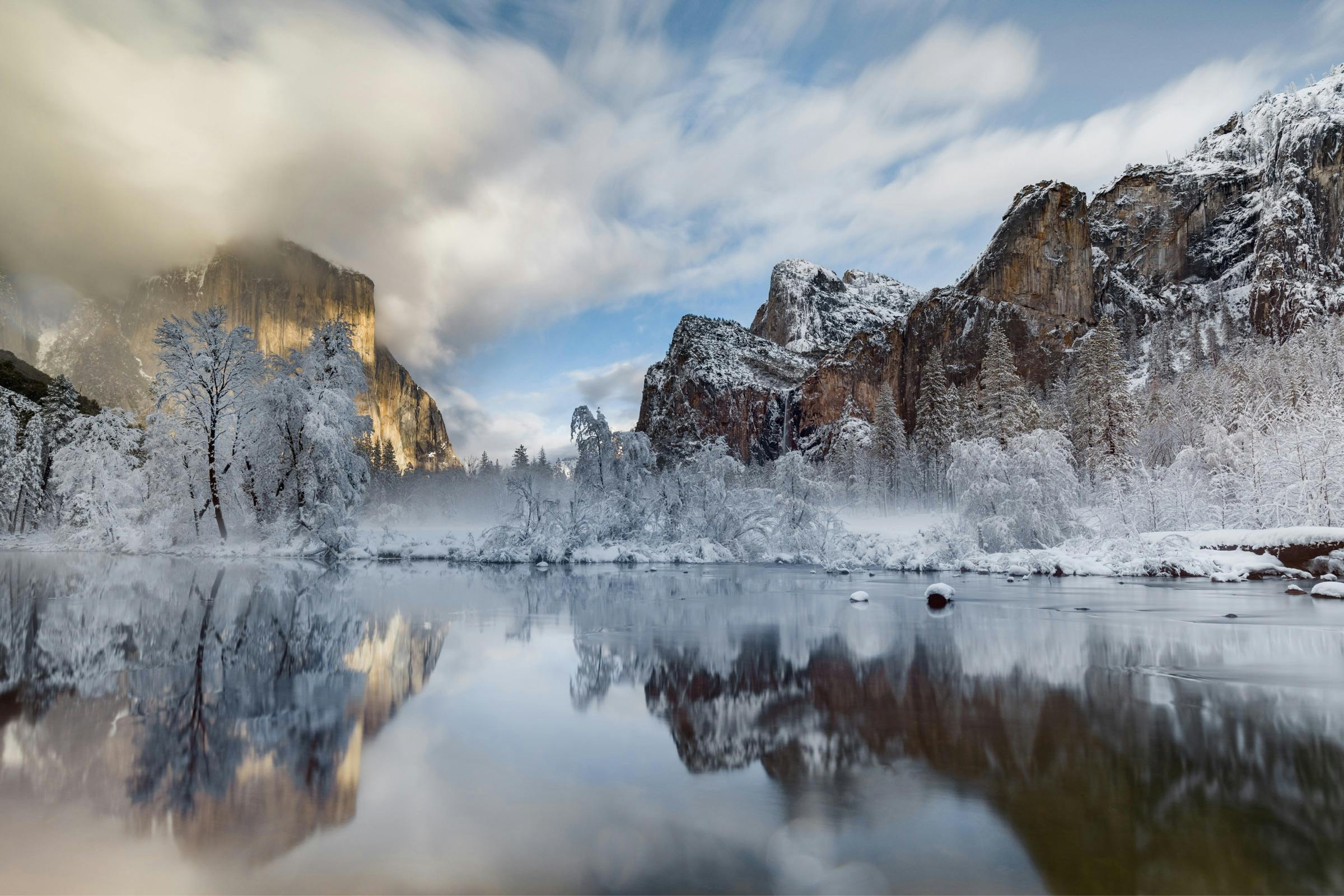 A frosty El Capitan and Bridalveil Falls reflecting in nearby pond.