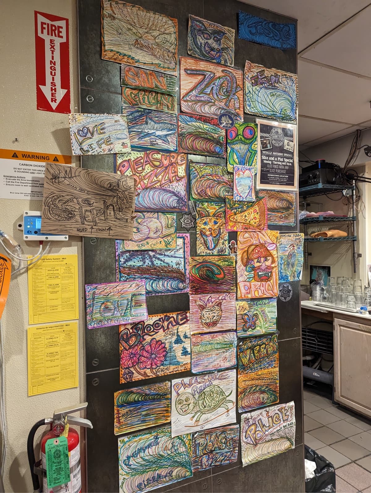 Drawings by Mikey Salcedo displayed at the Downtown Santa Cruz Pleasure Pizza